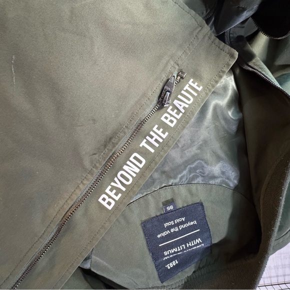 Green Raincoat with Stand-Up Collar and Zipper Closure - Picture 13 of 13